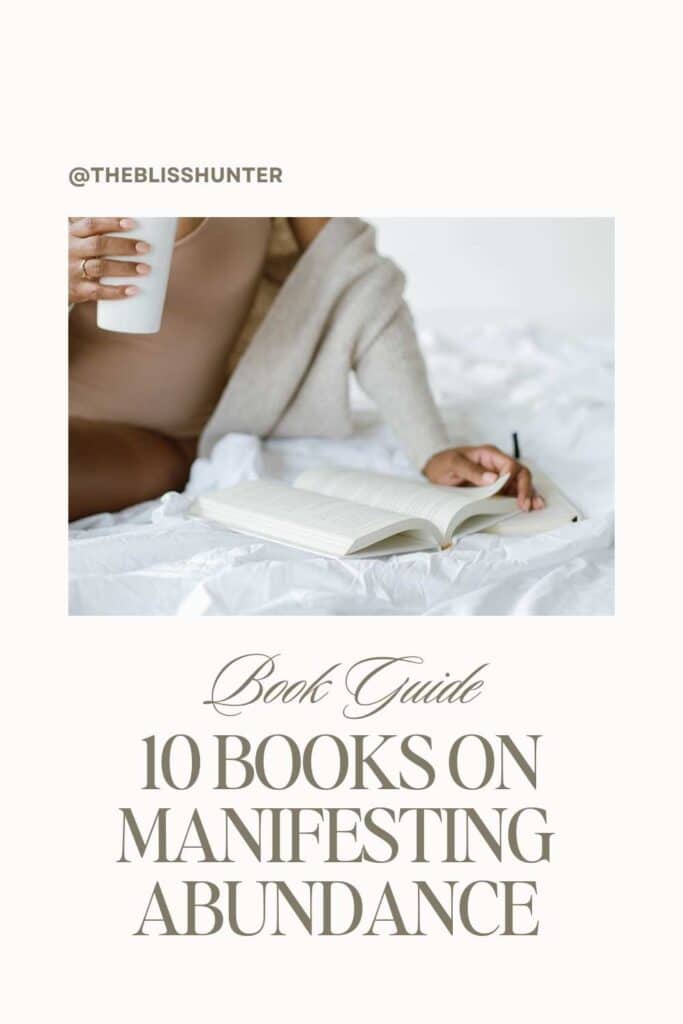 Discover the top 10 books on abundance minset and manifesting abundance with this guide from @theblisshunter, featuring a person cozily reading in bed, symbolizing the comfort and growth found in these reads.