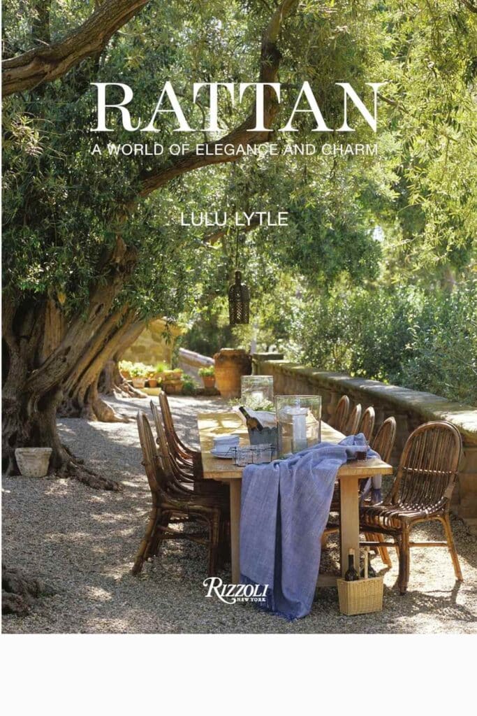 Rattan: A World of Elegance and Charm" by Lulu Lytle, a book cover depicting a serene outdoor rattan dining set in a lush garden.