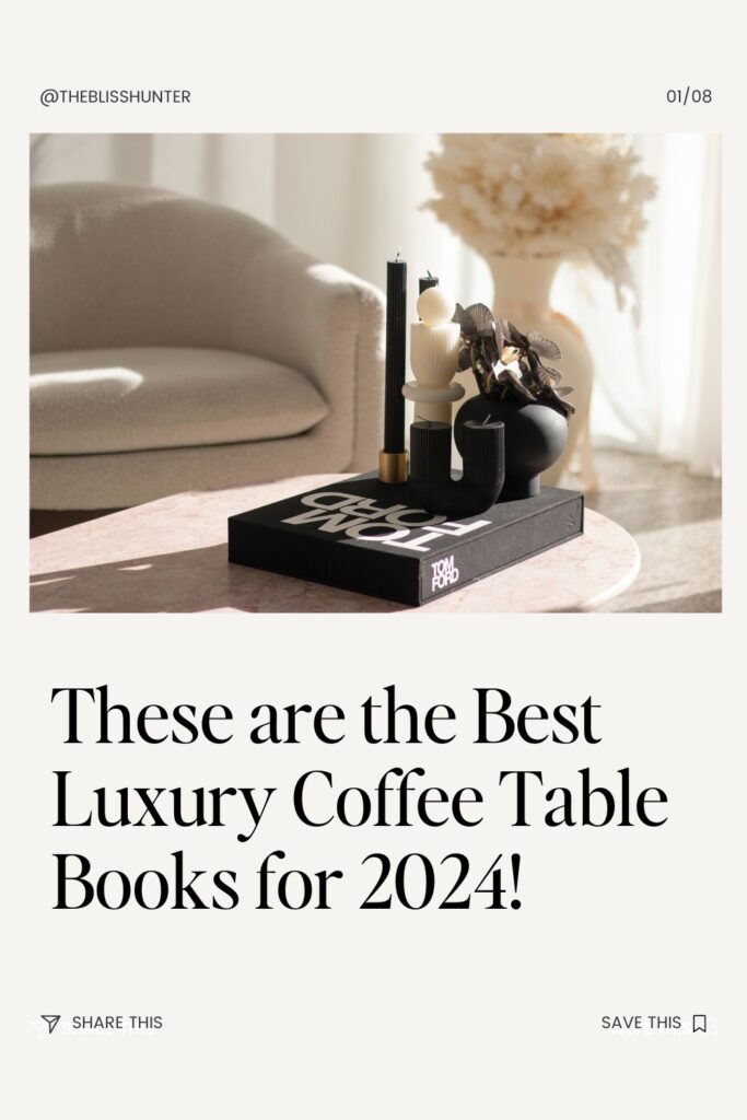 Luxury books like Tom Ford, with black pages and elegant binding, nestled against a marble backdrop and black candles