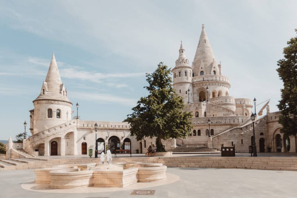 The grand towers of Fisherman's Bastion in Budapest standing against a clear sky
