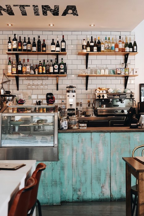 Cozy café counter with a vintage aesthetic, showcasing a selection of beverages and an espresso machine, inviting healthy coffee alternatives to the traditional coffee experience.