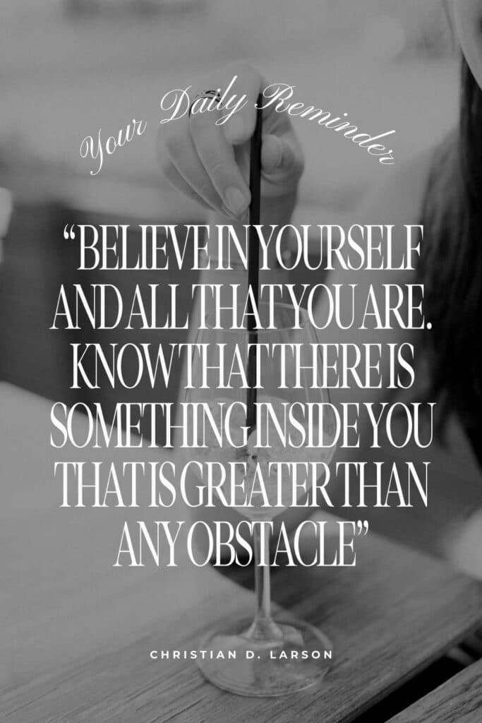 A grayscale image showcasing a person's hand holding a pencil, with an inspirational quote by Christian D. Larson about believing in oneself, overlaid on the image as a daily reminder of inner strength and confidence - Best books about Confidence