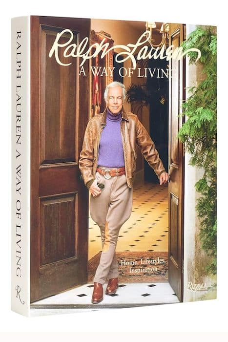 Luxury books: A glossy-covered coffee table book titled 'Ralph Lauren: A Way of Living' on a wooden background.