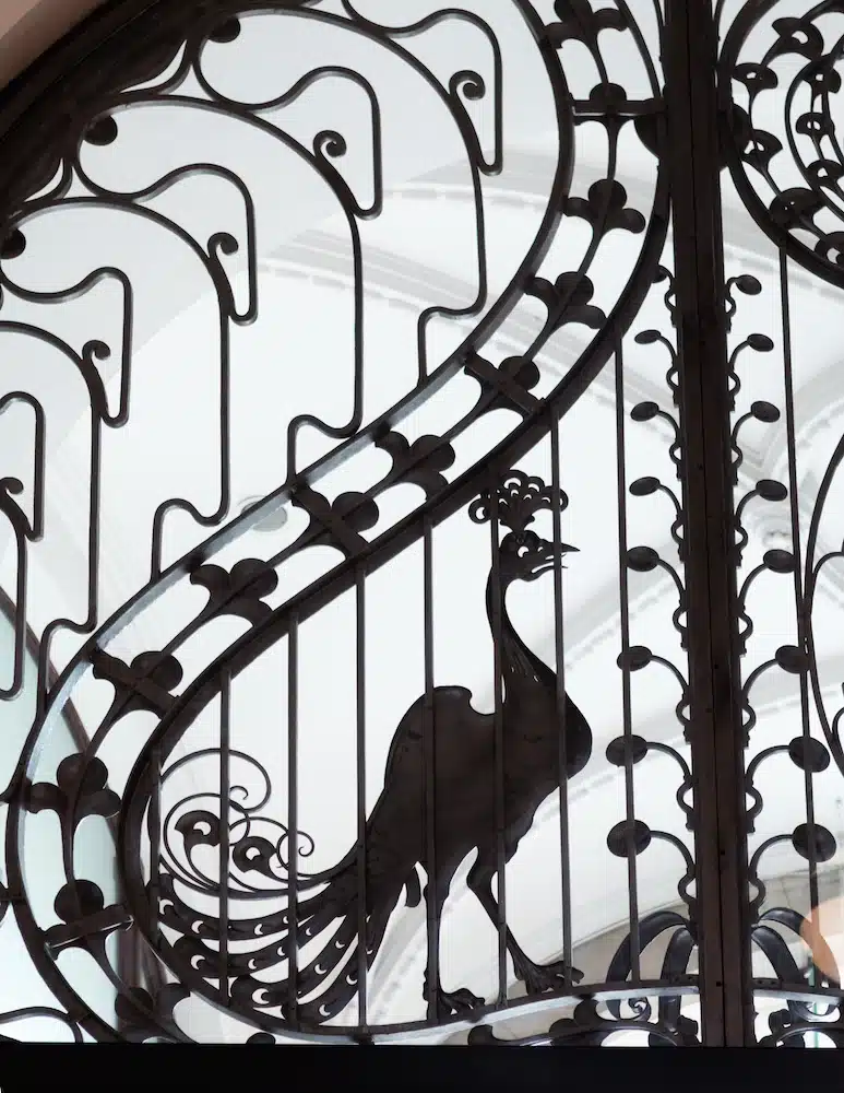 Art Nouveau wrought iron gate featuring a peacock silhouette at the Four Seasons Hotel in Budapest.