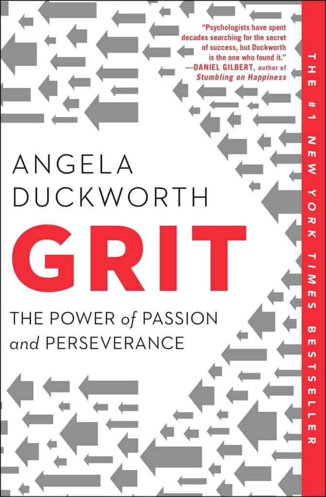 Cover of 'Grit: The Power of Passion and Perseverance' by Angela Duckworth, featuring a bold red and grey design with arrows pointing upwards, symbolizing progress and determination.