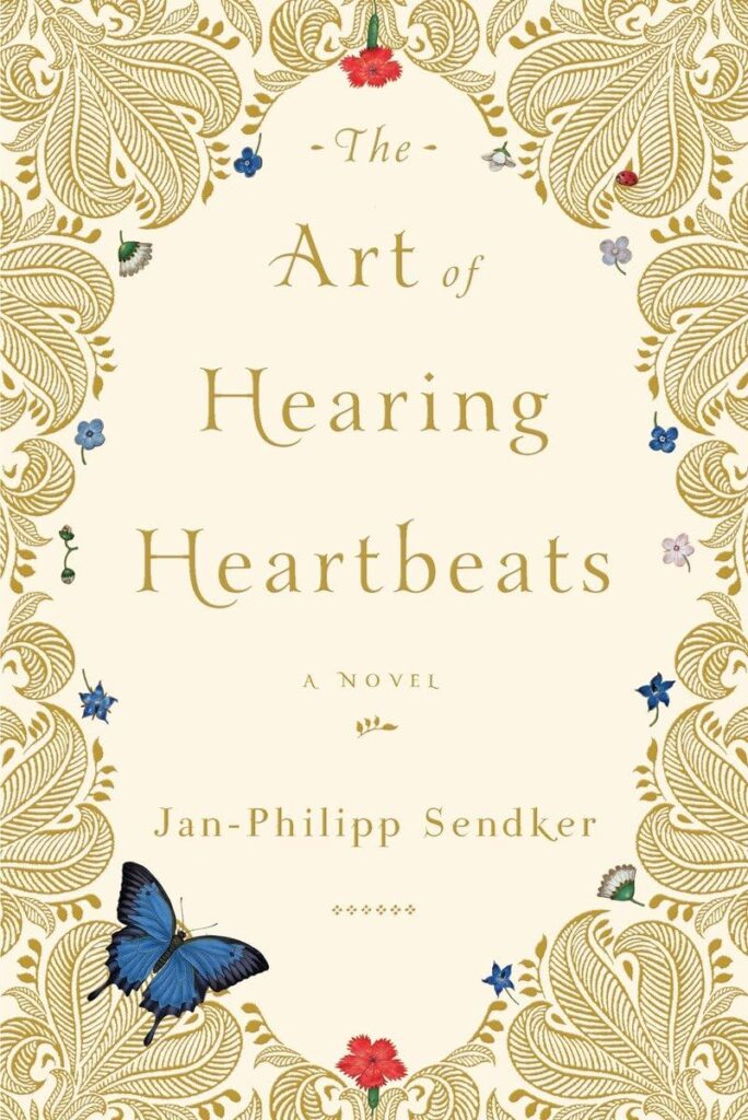 Elegant cover of 'The Art of Hearing Heartbeats' by Jan-Philipp Sendker, adorned with gold ornate patterns and colorful butterflies around the title - One of the best books for Wanderlust