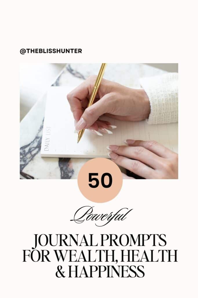 Close-up of a hand holding a golden pen over a journal, ready to inscribe powerful manifestation journal prompts.