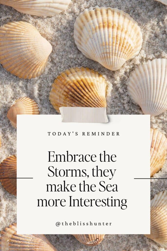 A collection of seashells on sand with an inspirational quote about embracing life's storms, one of the best inspiring Vitamin Sea quotes for instagram.
