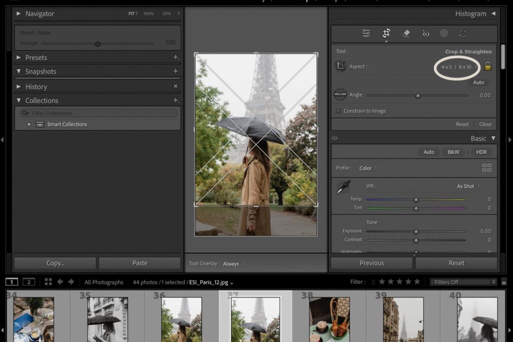 Editing a vertical photo of a woman with an umbrella in front of the Eiffel Tower inside Adobe Lightroom, shown during the cropping process.